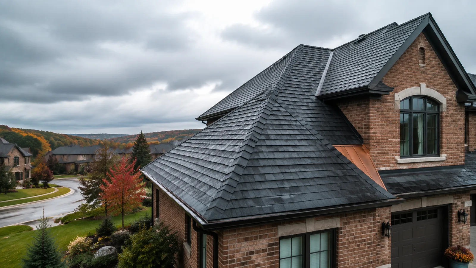 Wet asphalt-shingle roof, valleys, flashing, and eavestroughs on a Guelph-style brick home